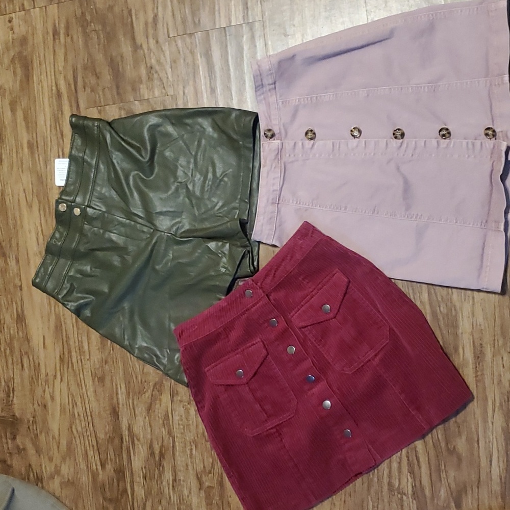 Bundle of 3. 2 mini skirts and 1 pair of faux leather shorts sz small/ …